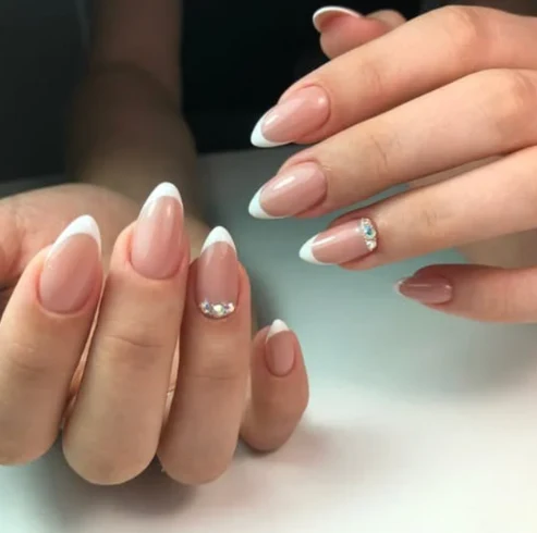 Pastel French tip nails with gold details